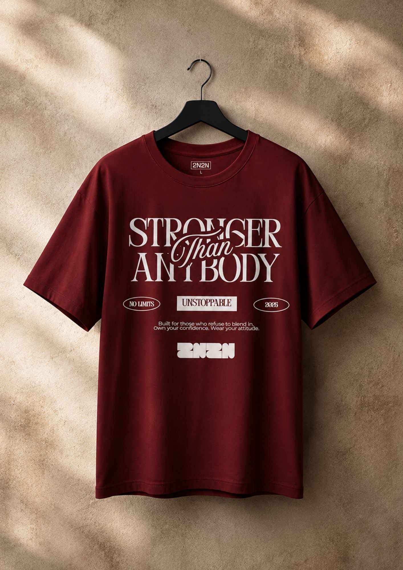 Stronger Than Anybody maroon tee on hanger